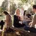Students sitting outdoors on Campus chatting